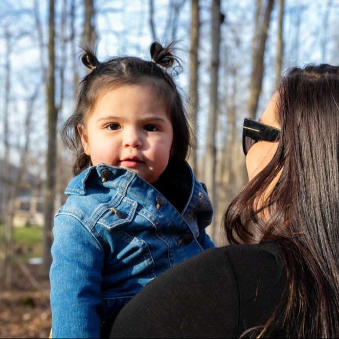 mother-holding-child-sunny-forest-indigenous-family